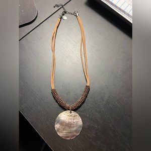 Brown 9” drop with a 2.5” extender shell necklace with cotton chain beading.